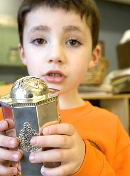 boy with tzedakah box